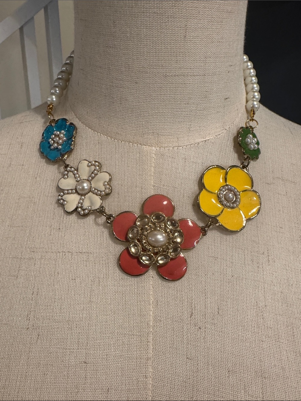 Bright and elegant Enamel Flower Necklace with faux pearl chain.